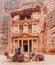 PETRA, JORDAN - MARCH 23, 2017: Camels in front of the Al Khazneh temple The Treasury in the ancient city Petra, Jord