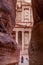 PETRA, JORDAN - MARCH 24, 2017: Local man in front of the Al Khazneh temple The Treasury in the ancient city Petra, Jord