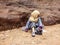 PETRA, JORDAN, NOV 25, 2011: Sitting little girl selling souvenirs for tourists