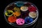 petri dish with array of microbes, each strain represented by a different color