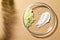 Petri dish with different samples on beige background, top view. Space for text