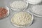 Petri dishes with different mineral fertilizers on table. Laboratory research