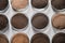 Petri dishes with soil samples on grey table. Laboratory research