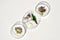 Petri dishes with various kinds of herbs and cosmetic product sample