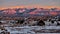 Petrified sand dunes and La Sal Mountains at sunset.