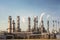 petrochemical complex, with towers and pipes stretching into the sky