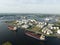 Petrochemical energy heavy transport industry cargo vessel tanker top down aerial drone view. Docked bulk carrier ship