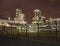 Petrochemical production plant against a cloudy sky at nighttime, Port of Antwerp, belgium