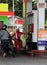 Petrol attendant filling up motorcycle