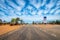 Petrol station in Australian dessert along endless straight road