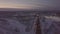 Petrol tanker with flashers standing on roadside on winter highway aerial view