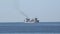 Petrol tanker ship with heavy charge sailing offshore on the blue sea