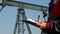 Petroleum Engineer Signing Documents at Oil Well