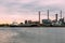 Petroleum oil refinery plant beside river in sunset time