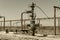 Petroleum well wellhead equipment. Hand valve with handwheel on the flow line. Oilfield site. Oil, gas industry concept
