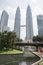 Petronas Twin Towers emerge from the KLCC garde