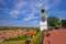 Petrovaradin clock tower and rooftops on Danube coast view