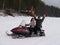 Petrozavodsk, Republic of Karelia / Russia - November 10, 2019: a man and a woman ride a snowmobile on a frozen lake. In the