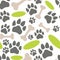 Pets paw pattern. Bones, flying saucer and animal footsteps seamless texture.