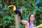 Petting a wild toucan