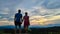 Petzen - Silhouette of couple enjoying the panoramic sunset view seen from mountain resort Petzen, Karawanks