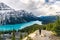 Peyto lake resemble of fox with woman traveler raised arm in Banff national park at Canada