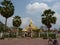 Pha That Luang stupa and the statue of King Setthathirat I