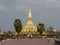 Pha That Luang stupa and the statue of King Setthathirat I