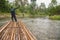 Phang nga, Thailand - Sept 12,2015 : Unidentified man who rafting on the brook Phang nga, Thailand. The bamboo raft for tourist