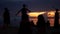 PHANGAN, THAILAND - 23 MARCH 2019 Zen Beach. Silhouettes of performers on beach during sunset. Silhouettes of young