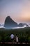 Phangnga Bay during sunrise, couple watching sunrise at the viewpoint Samet Nang Shee Thailand Phangnga province