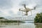 Phantom quadcopter drone flying over river