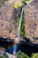 Phantom Waterfall dropping off over vertical basalt walls, North Table Mountain Ecological Reserve, Oroville, California