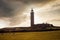 Phare du Cap Gris Nez at sunset. Sheeps in corral near lighthouse on Cap Gris-Nez of English channel in Cote d`Opale. France