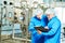 Pharmaceutical male workers in water preparation production line