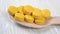 Pharmaceutical medicament yellow pills on a wooden background. In a wooden spoon.