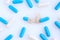 Pharmaceutical medicine capsules. Blue and white medicine capsules. Top view of medicine capsules. Opened capsule