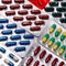 Pharmaceuticals, antibiotics, tablets, medications. Colorful antibacterial pills on a dark background. Capsules, tablets,