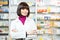 Pharmaceutist woman worker in drug store