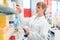 Pharmacist or Chemist woman sorting drugs in shelves in her pharmacy