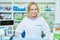 Pharmacist chemist woman working in pharmacy drugstore