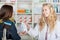 Pharmacist Giving Paperbag To Customer