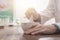 Pharmacist grinding a preparation using a pestle