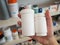 Pharmacist hand hold medicine bottles