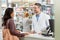 Pharmacist help customer, health and medicine with conversation, service in pharmacy with advice and pills prescription