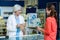 Pharmacist packing medicine in paper bag for customer