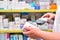 Pharmacist scanning barcode of medicine drug