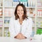 Pharmacist With Tablets At Pharmacy Counter