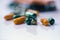 Pharmacy background on a white table. Tablets on a white background. Pills. Medicine and healthy. Close up of capsules. Different