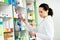 Pharmacy chemist woman in drugstore